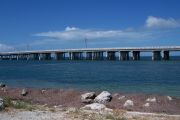 Photo: Buttonwood: Gravel site, rip rap, dead seagrass, water and new Bahia Honda Bridge in the background.