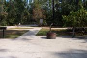 Fire ring and sidewalk at side with ADA accessibility.