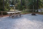 A view of the picnic table and grill.
