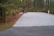 A view of the campsite with a shell/sand/grass base.