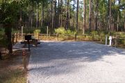 A view of the campsite with a shell/sand/grass base.