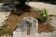 Photo: 005, JOHN PENNEKAMP CORAL REEF SP. Rock with white campsite number and white arrows pointing to site on brown metal plate.