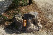 Photo: 017, JOHN PENNEKAMP CORAL REEF SP. Rock with white campsite number and white arrows pointing to site on brown metal plate.