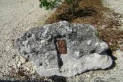 Photo: 024, JOHN PENNEKAMP CORAL REEF SP. Rock with white campsite number and white arrows pointing to site on brown metal plate.