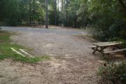 Campsite with picnic table facing neighboring campsite.