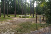 Pull through campsite with water, electric and two picnic tables.