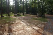 Pull through campsite with water, electric and two picnic tables.