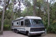 Each site is equipped with a picnic table, clothesline/lantern post, hose bib, electric hook-up for 20 and 50 amp service, and fire pit on the ground with a fold over grill top.