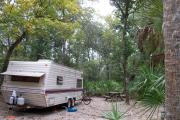 Each site is equipped with a picnic table, clothesline/lantern post, hose bib, electric hook-up for 20 and 50 amp service, and fire pit on the ground with a fold over grill top.