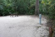 Each site is equipped with a picnic table, clothesline/lantern post, hose bib, electric hook-up for 20 and 50 amp service, and fire pit on the ground with a fold over grill top.