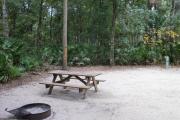 This view shows an up close view of the picnic table and grill.