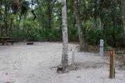 Each site is equipped with a picnic table, clothesline/lantern post, hose bib, electric hook-up for 20 and 50 amp service, and fire pit on the ground with a fold over grill top.