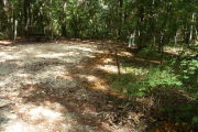 Deep campsite with picnic table, water and electric hookups