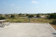 Picture of campsite amenities including campfire ring and picnic table