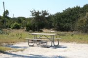 Picture of campsite amenities including campfire ring and picnic table