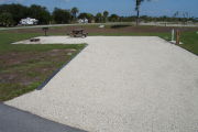 Photo: 001, Campsite with picnic table, grill and fire ring on the left and water and electric on the left.