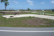 Photo: 001, A view of the campsite with the rest of the campground in the background.