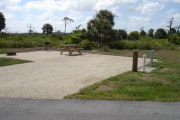 Photo: 014, Campsite with picnic table, grill and fire ring on the left and water and electric on the left.