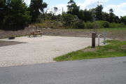 Photo: 020, Campsite with picnic table, grill and fire ring on the left and water and electric on the left.