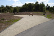 Photo: 022, Campsite with picnic table, grill and fire ring on the left and water and electric on the left.