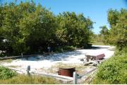 Photo: 025, With the fire ring and picnic table in the fore ground, the water and electric service is seen midway to the far left.