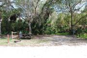 Campsite 35 is a partial sunny site with a gravel foundation located on the right hand side of the road.  Looking into the site on the right is the water and 50amp electrical service. There is a picnic table and ground campfire ring.  At the front left side of the site is the brown site marker.