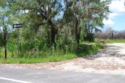 Campsite #89 is a partial shady site with stone foundation and vegetation on sides located on the right hand side of the road.  Looking into the site on the right are the water, 50 amp electric and sewage hook-ups.  To the left is a separate section containing a picnic table, cooking grill and ground campfire ring.  At the front left side of the site is the brown site marker.