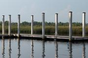 Late afternoon view of the ADA-accessible floating dock from the sandy beach located at Ochlockonee River State Parkâs picnic and day use area.