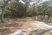 Under a canopy of oaks, this cozy site is located on the inside of our loop-shaped campground. At 32 foot, the width of the site allows for great flexibility in RV/Tent or camping with more than one tent.