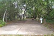 Conveniently located, this site has a 25 feet wide cement slab and walkway providing full access to campground facilities. This and Sites 18 and 19 are located in a cul-de-sac, offering some privacy.