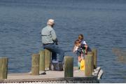 A group of anglers fishing from the dock at Fred Gannon Rocky Bayou State Park.