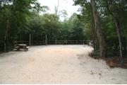 40 foot back in site surrounded by beautiful trees and split rail fencing.