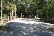 32 foot back in site surrounded by beautiful trees and split rail fencing.