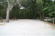32 foot back in site surrounded by beautiful trees and split rail fencing