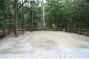 32 foot back in site surrounded by beautiful trees and split rail fencing.