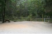 36 foot back in site surrounded by beautiful trees and split rail fencing.