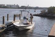 Early in the morning two men prepare their boat and gear for a fishing getaway at the St. Andrews State Park boat launch.