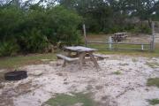 Site three has a level ground with a sandy to solid base.