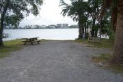 An array of native shrub and oak borders both sides of this campsite leading down to the Grand Lagoon.