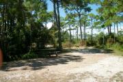 View from the right showing picnic table and ground grill.
