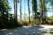 View from the right showing picnic table and ground grill.