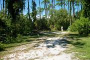 View from the left showing picnic table and ground grill.
