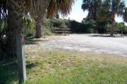 View from the front showing the picnic table and clothes posts in the back of the site.
