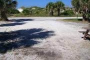 View from the back showing dunes and vegetation across the street.