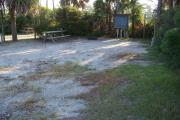 View from the front showing the picnic table on the left and the fire ring in the back of the site.