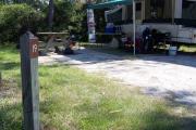 view from the front showing a RV set up in the site.