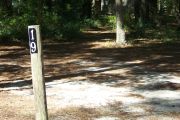 This site includes water, septic, and electric.  Accommodates tents, pop ups and RV's.