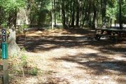 This site is a pull through and includes water, septic, and electric.  Accommodates tents, pop ups and RV's.