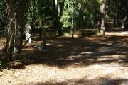 This site is a pull through and includes water, septic, and electric.  Accommodates tents, pop ups and RV's.
