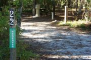 This site includes water, septic, and electric.  Accommodates tents, pop ups and RV's without slide outs or awnings.